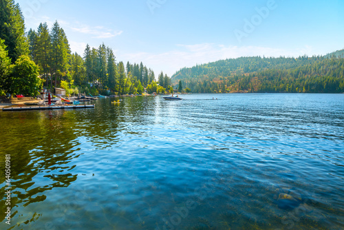 Fototapeta Naklejka Na Ścianę i Meble -  Summer day view of lakefront homes and docks at lower Twin Lakes, an 850 acre lake in the small suburban town of Twin Lake, Idaho, a suburb of the general Coeur d'Alene area of North Idaho.