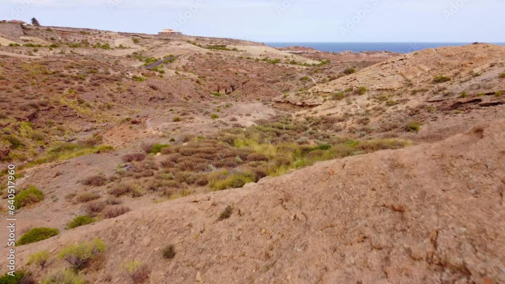 Canyon rock formation and mountains next to sea