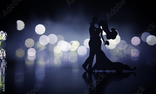 Black silhouettes of pair dancers performing. Man and woman are dancing with white backlight. Choreography. New Year s ball