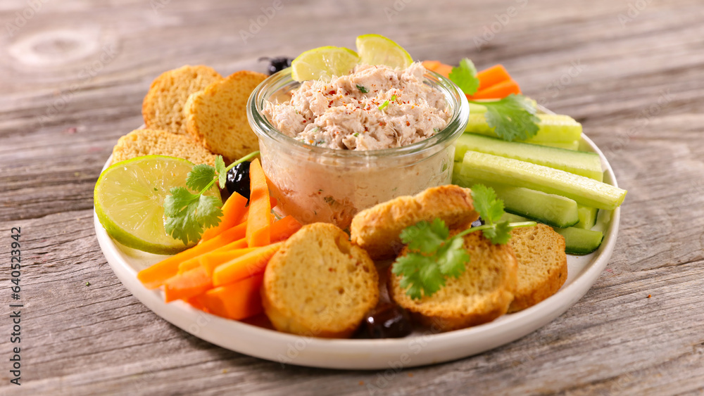 vegetarian dip table- cucumber, carrot,bread toast and tuna spread vegetarian dip table- cucumber, carrot,bread toast and tuna spread