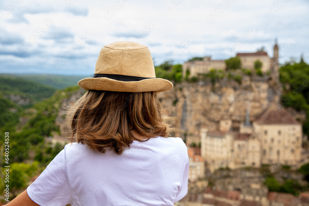 Young boy admiring view of Rocamadour village in France- Lot region
