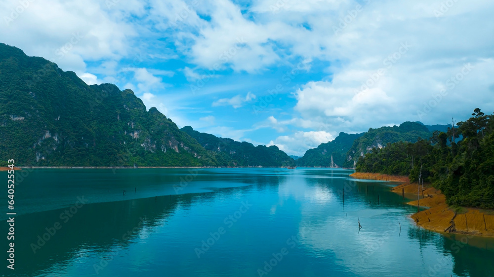 Aerial view at Khao Sok national park Cheow Lan Dam lake with blue sky background  in Surat Thani, Thailand