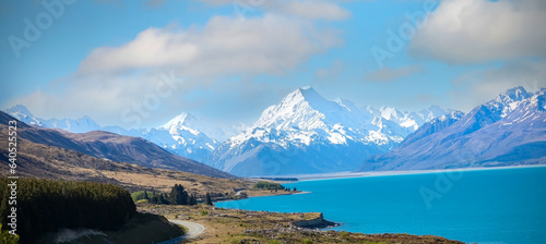The road trip with mountain landscape view of blue sky background over Aoraki mount cook national park,New zealand
