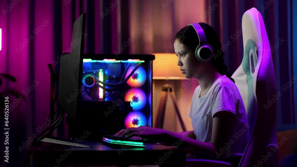 Serious Asian Teen Girl Gamer Playing Video Game On Computer
Serious Asian Teen Girl Gamer Playing Video Game On Computer