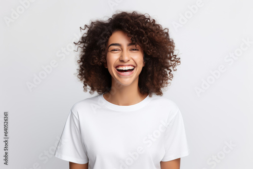 Cheerful Young Woman Model On White Background . Сoncept Smile Confidence, Young Woman Empowerment, Beauty Selflove, Age Inclusivity © Anastasiia