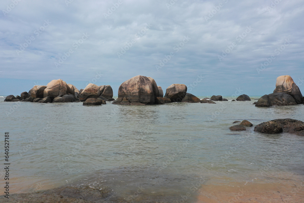 Landscape of rocks and flowing sea water on the coast	