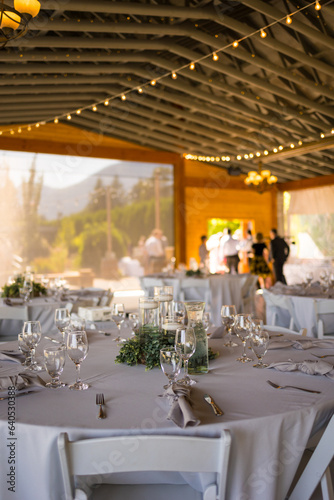 Charming table set up awaits guests at rustic barn wedding