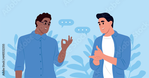 A pair of deaf and mute people communicate using sign language. An elderly African-American man and a hearing-impaired young man.