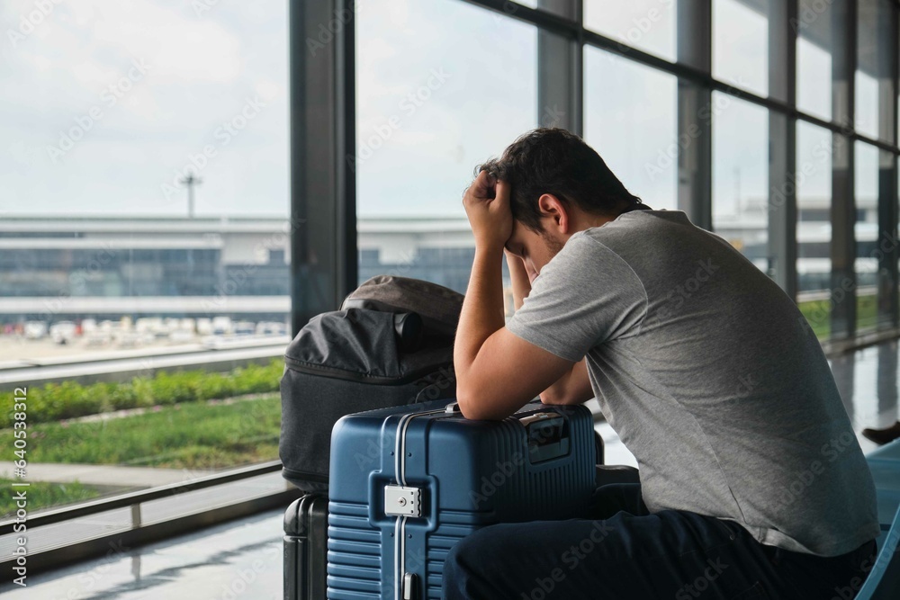 Frustrated man at Narita airport, annoyed because his flight was canceled.