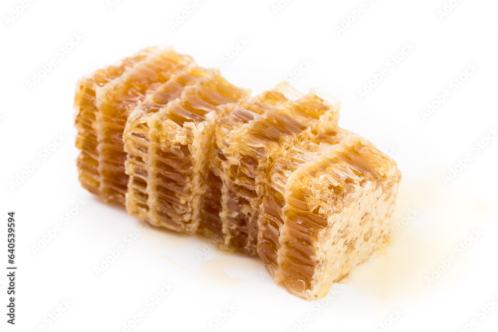 Fresh honey in the comb close-up isoleted on white background. Fresh honey in the comb close-up isoleted on white background.