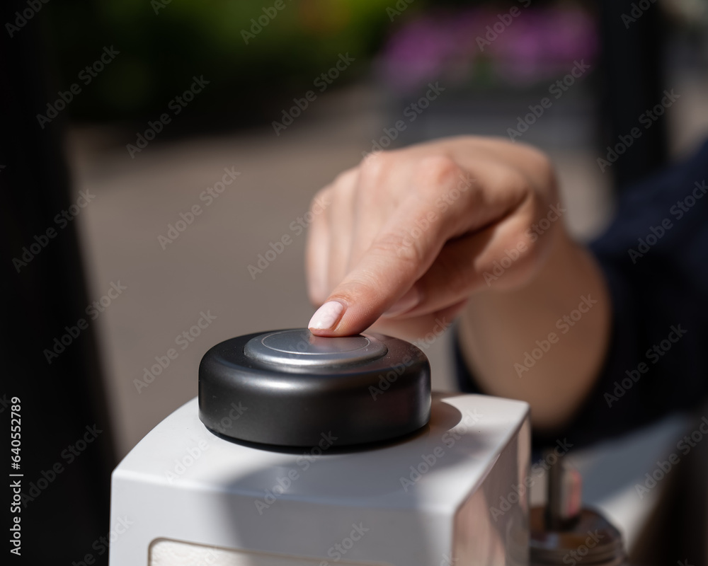 Woman pressing button to call waiter in cafe. Woman pressing button to call waiter in cafe.