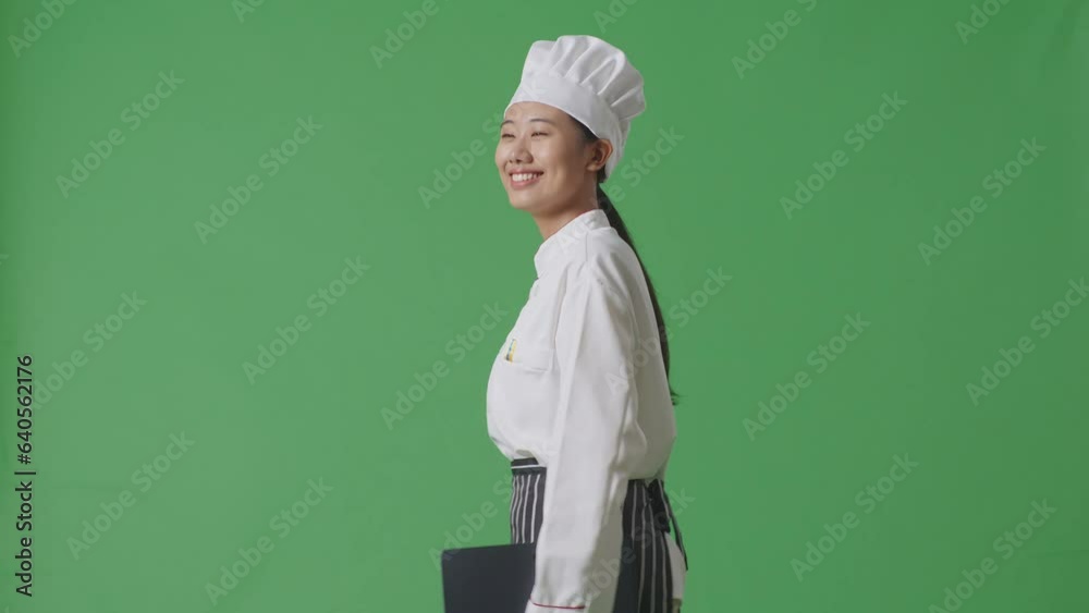 Side View Of Asian Woman Chef Holding A Tablet While Walking In The Green Screen Background Studio
Side View Of Asian Woman Chef Holding A Tablet While Walking In The Green Screen Background Studio