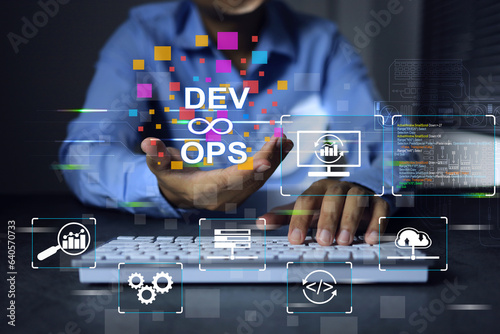Принти на полотні devops engineer or development operation software developer programmer holding dev and ops icon in hand while working with laptop to deploy code and software monitor on agile working concept