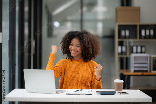 Businesswoman talking to customers online together at the office.