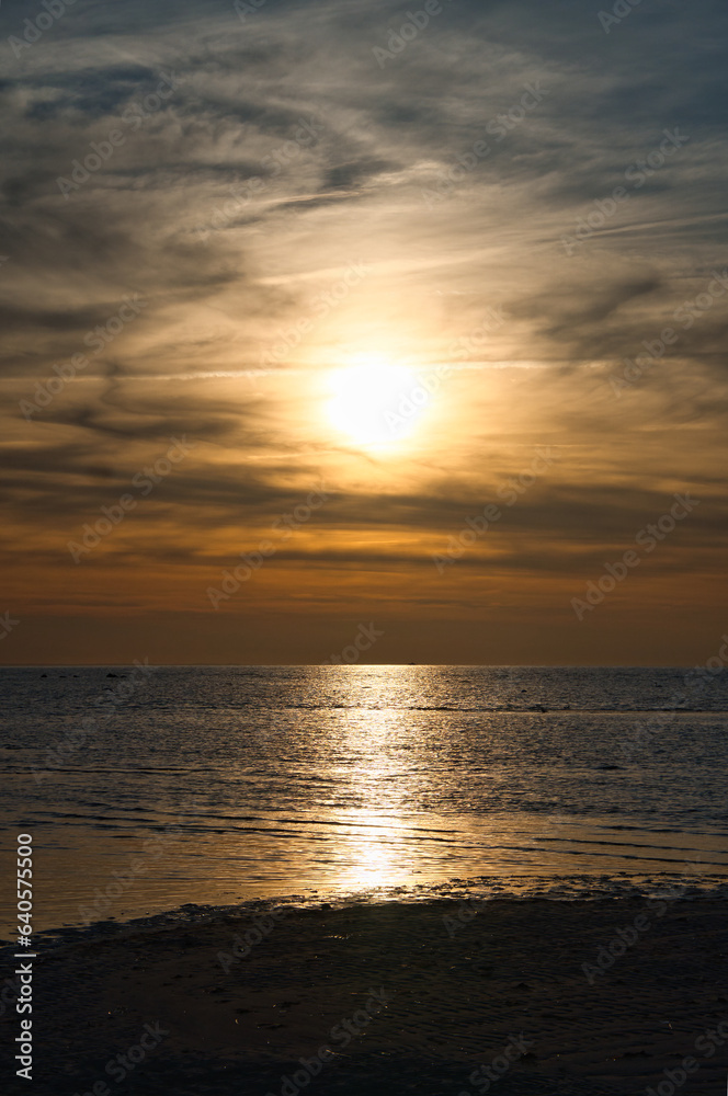 Sunset, illuminated sea. Light waves. Poel island on the Baltic Sea. Nature photo