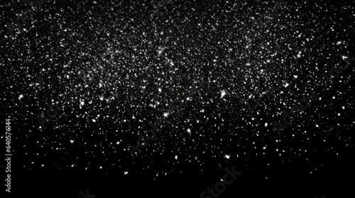 Snow or snowflakes falling texture. Concept of a blizzard or snowfall. Black Matte to use as an overlay. Shallow field of view. photo