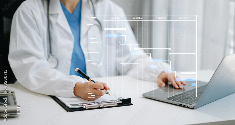 Project manager working and update tasks with Gantt chart scheduling diagram at hospital .success smart medical doctor working with smart medical doctor Project manager working and update tasks with Gantt chart scheduling diagram at hospital .success smart medical doctor working with smart medical doctor