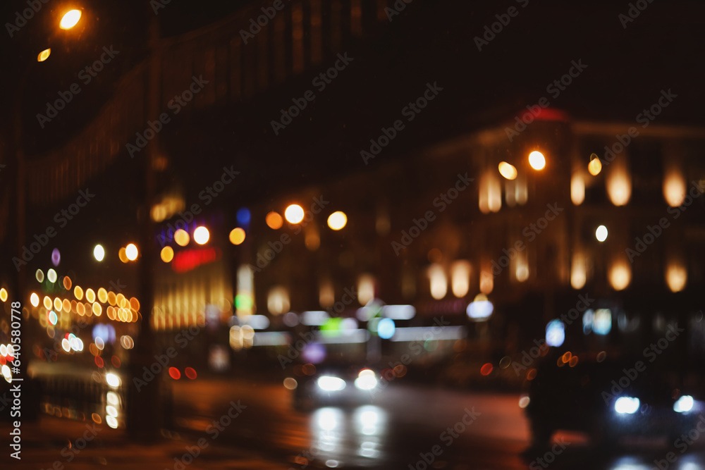 Colorful lights of urban city surrounding moving and blurred by motion. the light trails on the street. Blurred defocused lights of city traffic 