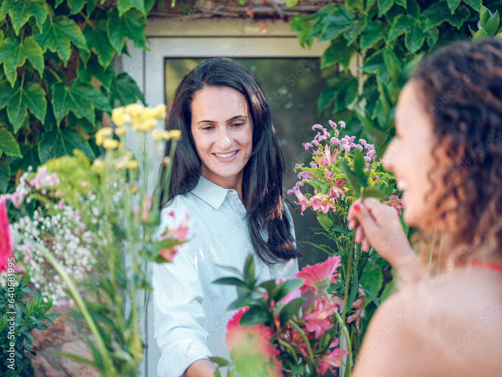 Smiling female florist and client in flower shop Smiling female florist and client in flower shop