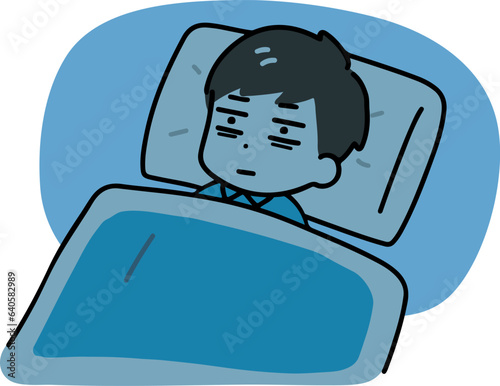 布団の中でなかなか眠れない男性