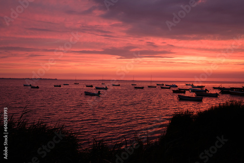 Fishing boats in the red Sunset light © Michal