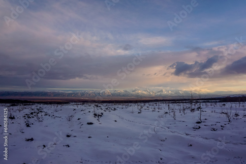 Snow covered mountains at sunset