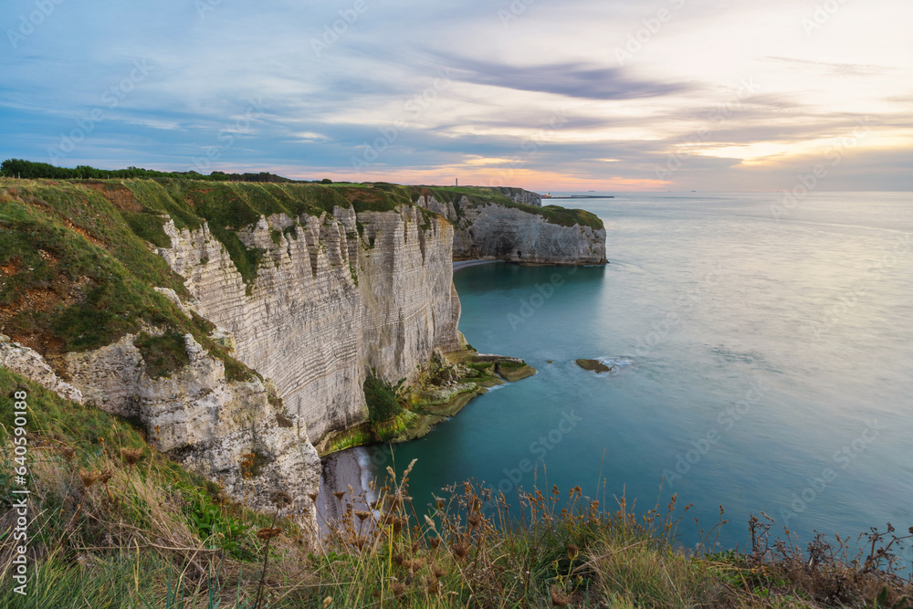 Sunrise view of the cliff of Etretat, Normandy, France. Coastal landscape of white rocks and la Manche channel. Popular travel destination