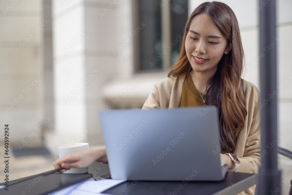 Asian woman executive thoroughly analyzes, remotely approves investment for strategic company growth Asian woman executive thoroughly analyzes, remotely approves investment for strategic company growth