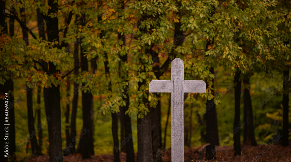 Wooden orthodox crosses in the autumn forest