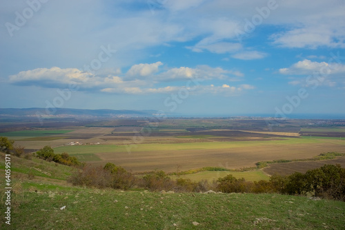 Panoramic view of the endless horizon of fields on a clear sunny day