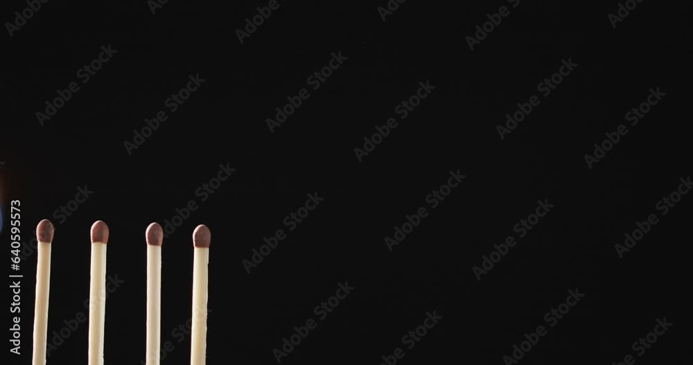 Video of matches with yellow fire flame and copy space on black background Video of matches with yellow fire flame and copy space on black background