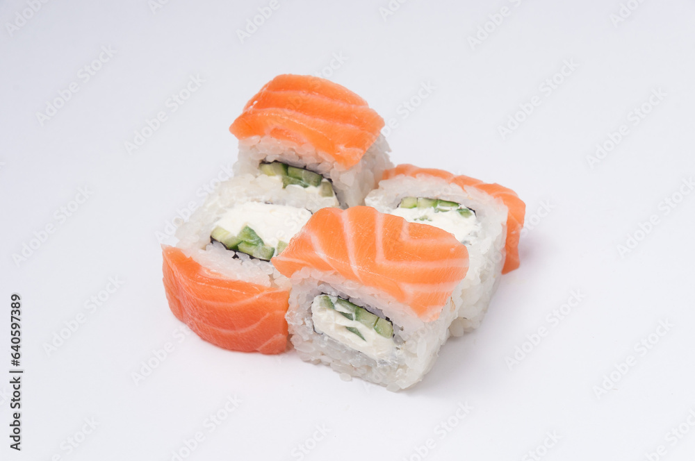 philadelphia roll with cucumber on a light background philadelphia roll with cucumber on a light background