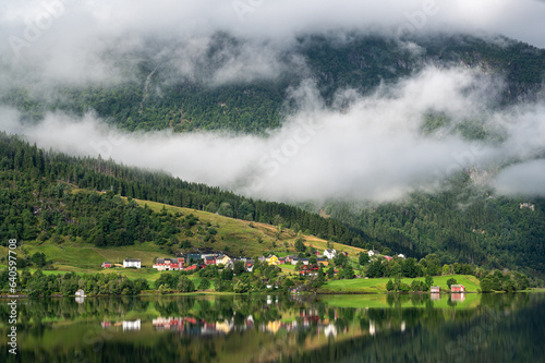 cozy little village along a norwegian lake