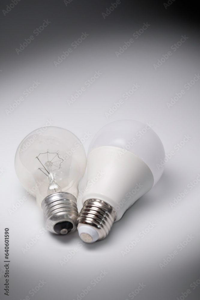 Old incandescent light bulb and new energy-saving light bulb Old incandescent light bulb and new energy-saving light bulb
