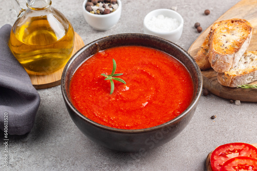 Tomato soup with rosemary.  Healthy, vegan and dieting lunch and dinner concept. Gazpacho. 