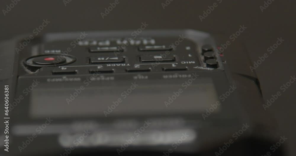 Finger pressing stop on portable audio recorder Finger pressing stop on portable audio recorder