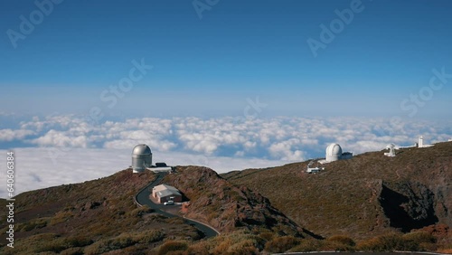 Panoramic view with clouds in the background, of the Roque de los Muchachos observatory located in the Caldera de Taburiente national park, on the island of La Palma and on a sunny day. photo