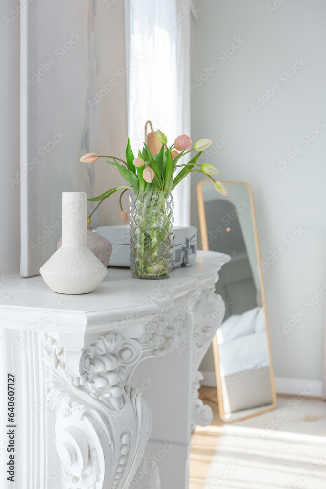 the white fireplace is decorated with stucco in a luxurious istoic palace style in a gentle cozy bright apartment with huge panoramic windows with sunlight the white fireplace is decorated with stucco in a luxurious istoic palace style in a gentle cozy bright apartment with huge panoramic windows with sunlight