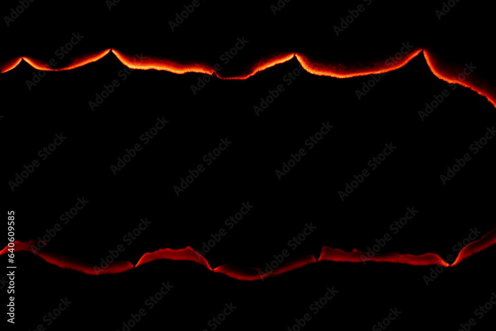 burning paper, glowing edge of paper on a black background burning paper, glowing edge of paper on a black background