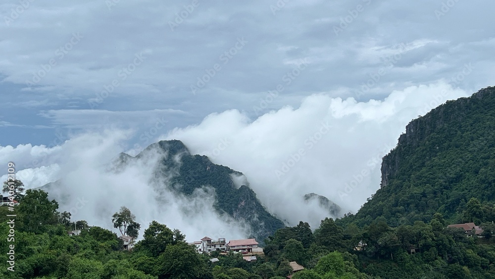 Scenic view of  misty mountain in winter season at  Doi Pha Hee, Chiang Rai, Thailand.