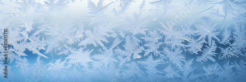 Winter iced pattern on frozen window glass  macro frosty crystals ornament. Long banner