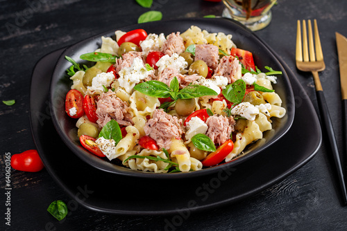 Pasta with tuna, tomatoes and feta cheese. Pasta salad with tuna. Healthy italian food. Healthy dinner.