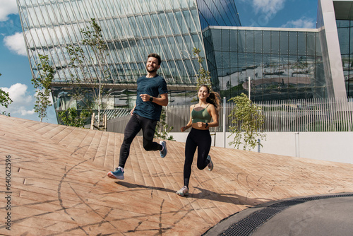 A woman and a man doing sports running. Friends run together. Fitness exercises for a healthy lifestyle. Running fast in full height in the fresh air. Sports people, training together.