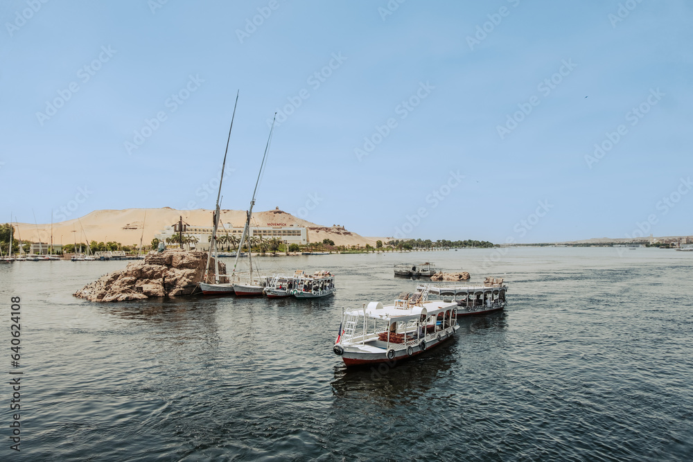 Egypt Summer Travel Riverside Tranquility: Small Boats by Luxor's Nile Banks Egypt Summer Travel Riverside Tranquility: Small Boats by Luxor's Nile Banks