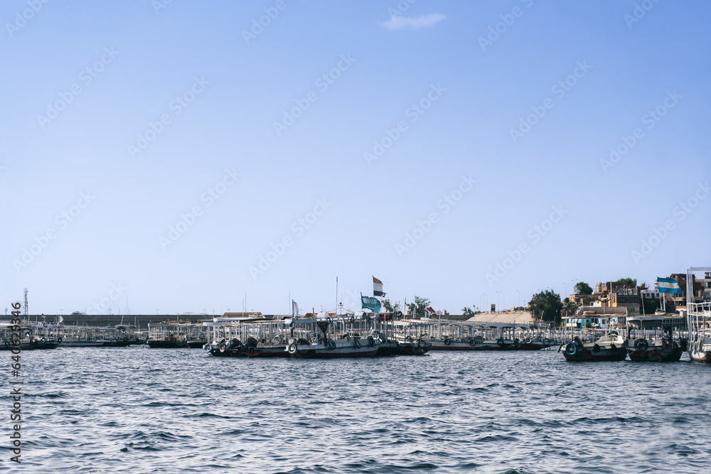 Egypt Summer Travel Tranquil Waterside Haven: Boats in a Nile River Village Egypt Summer Travel Tranquil Waterside Haven: Boats in a Nile River Village