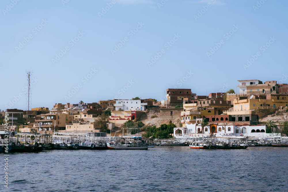 Egypt Summer Travel Tranquil Waterside Haven: Boats in a Nile River Village Egypt Summer Travel Tranquil Waterside Haven: Boats in a Nile River Village