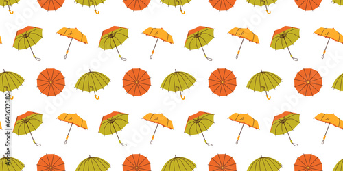 Seamless pattern with hand drawn red yellow green opened umbrellas on white background in flat cartoon style. For background, packaging, textile