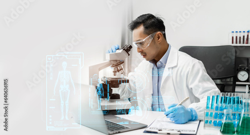 Male scientist researcher conducting an experiment working in the chemical laboratory.