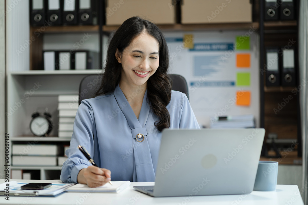 Business women hand working with tablet and laptop computer with documents on office desk in modern office. Business women hand working with tablet and laptop computer with documents on office desk in modern office.