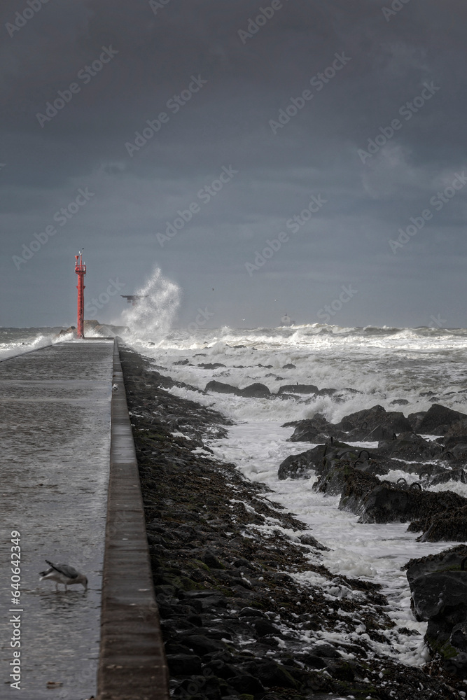 Stormy weather at the pier of Hoek van Holland, a seaside and port town along the Dutch coast near Rotterdam; Hoek van Holland, Netherlands
